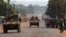 French peacekeeping soldiers advance in armored vehicles in Miskine district, a neighborhood that in the past few days experienced violent sectarian clashes, in the capital Bangui, Central African Republic, Jan. 30, 2014. 