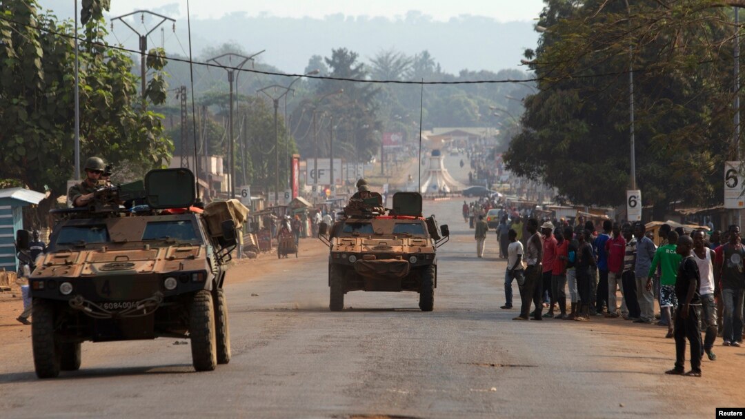 French peacekeeping soldiers advance in armored vehicles in Miskine district, a neighborhood that in the past few days experienced violent sectarian clashes, in the capital Bangui, Central African Republic, Jan. 30, 2014. 