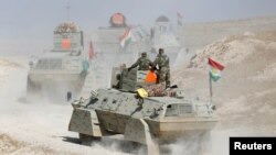 Peshmerga forces advance in the east of Mosul to attack Islamic State militants in Mosul, Iraq, Oct. 18, 2016. 