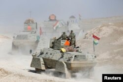 Peshmerga forces advance in the east of Mosul to attack Islamic State militants in Mosul, Iraq, Oct. 18, 2016.