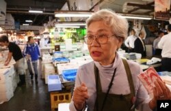 Tai Yamaguchi of fish wholesaler Hitoku Shoten, speaks during an interview with the Associated Press at Tsukiji fish market in Tokyo, Sept. 26, 2018. “If the new place were better, I’ll be happy to move,” said Yamaguchi. Yamaguchi feels it has been mishandled by authorities who failed to fully consult those affected.