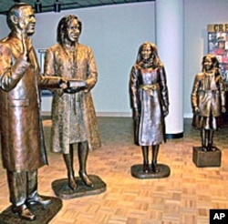 Life-size sculptures of the four Obama family members comprise "The Inauguration of Hope"