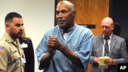 Former pro football star O.J. Simpson reacts after learning he was granted parole at Lovelock Correctional Center in Lovelock, Nev., July 20, 2017. 