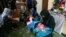 FILE - Victims of violence sew at a shelter operated by the Humanitarian Assistance for the Women and Children of Afghanistan, an NGO, in Kabul, Afghanistan, April 5, 2017. 