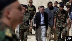 U.S. Ambassador to Lebanon David Hale (C) arrives in Taibeh village near the city of Baalbek, eastern Lebanon, Wednesday, June 10, 2015, where he was to attend a Lebanese army live-fire demonstration of advanced U.S. missiles.