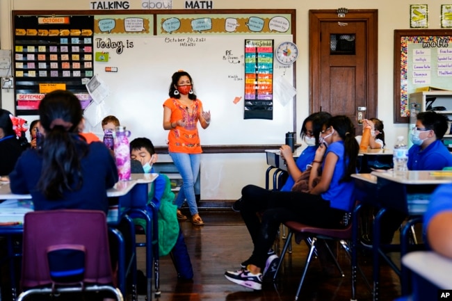 Student teacher Olivia Vazquez leads students through their morning meeting at the Eliza B. Kirkbride School in Philadelphia, Wednesday, Oct. 20, 2021. (AP Photo/Matt Rourke)