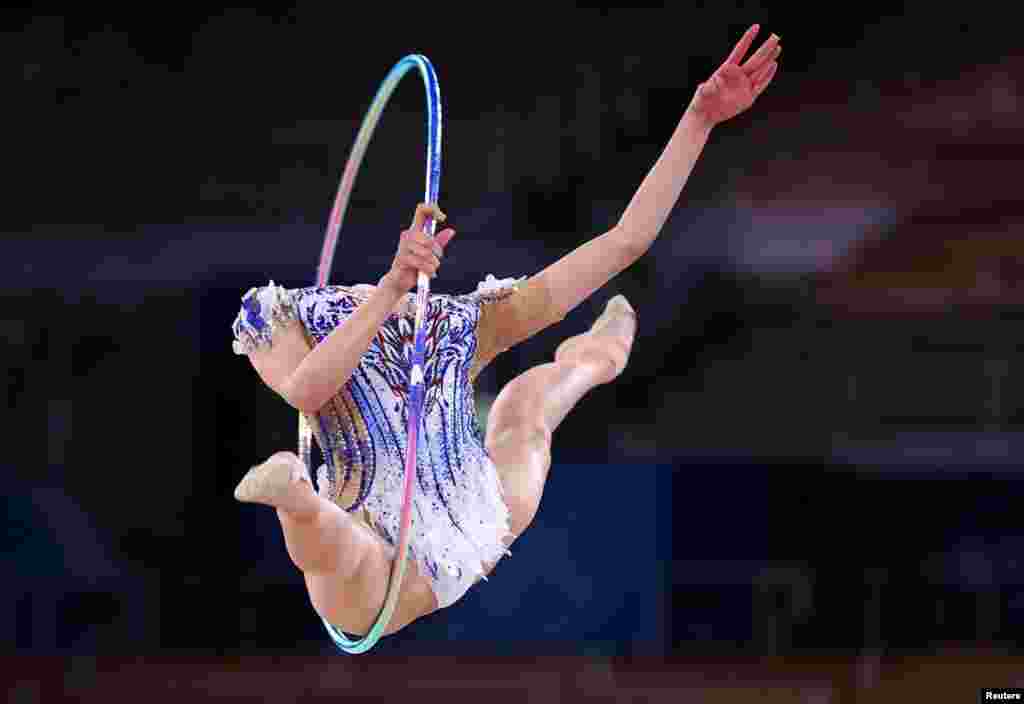 Chisaki Oiwa of Japan competes with a hoop in the individual all-around of rhythmic gymnastics during the 2020 Olympics, at the Ariake Gymnastics Centre, Tokyo, Japan.