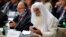 Participants plug in their translator devices during the opening of an international conference on religious and ethnic minorities being persecuted under the Islamic State group, in Paris, France, Sept. 8, 2015. 