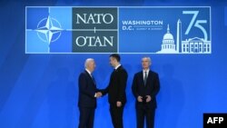 Montenegro's Prime Minister Milojko Spajic (C) poses with US President Joe Biden (L) and NATO Secretary General Jens Stoltenberg during the NATO 75th anniversary summit at the Walter E. Washington Convention Center in Washington, DC, on July 10, 2024. (Ph