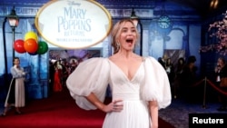 Cast member Emily Blunt reacts on the red carpet at the world premiere of Disney's movie "Mary Poppins Returns" in Los Angeles, California, Nov. 29, 2018. 