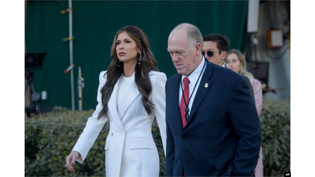 Homeland Security Secretary Kristi Noem and White House border czar Tom Homan walk at the White House in Washington, Jan. 29, 2025.