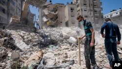 Les décombres d'un bâtiment détruit lors d'une frappe aérienne israélienne sur la ville de Gaza le 27 mai 2021.