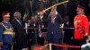 Kenya's President Uhuru Kenyatta (C) displays the special sword that he received to represent his instruments of power from his predecessor, Mwai Kibaki (2nd L), after his official swearing-in ceremony at Kasarani Stadium in Nairobi, April 9, 2013.