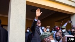 President-elect Hakainde Hichilema (C) waves to supporters after a press briefing at his residence in Lusaka, Zambia, Aug. 16, 2021.