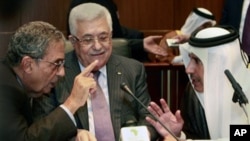 Palestinian President Mahmoud Abbas, center, listens to Qatar's Foreign Minister Sheik Hamad Bin Jassem, right, and Amr Moussa, secretary general of the Arab League, during the Arab Foreign Ministers Peace Initiative meeting, in Sirte, Libya, 8 Oct. 2010