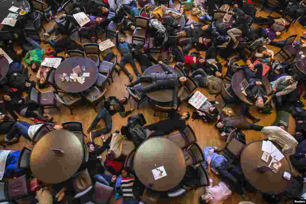 Student activists stage a &#39;die-in&#39; as part of the nationwide &quot;Hands up, walk out&quot; protest, demanding justice for the fatal Aug. 9 shooting of 18-year-old Michael Brown, at Washington University in St. Louis, Missouri, USA.