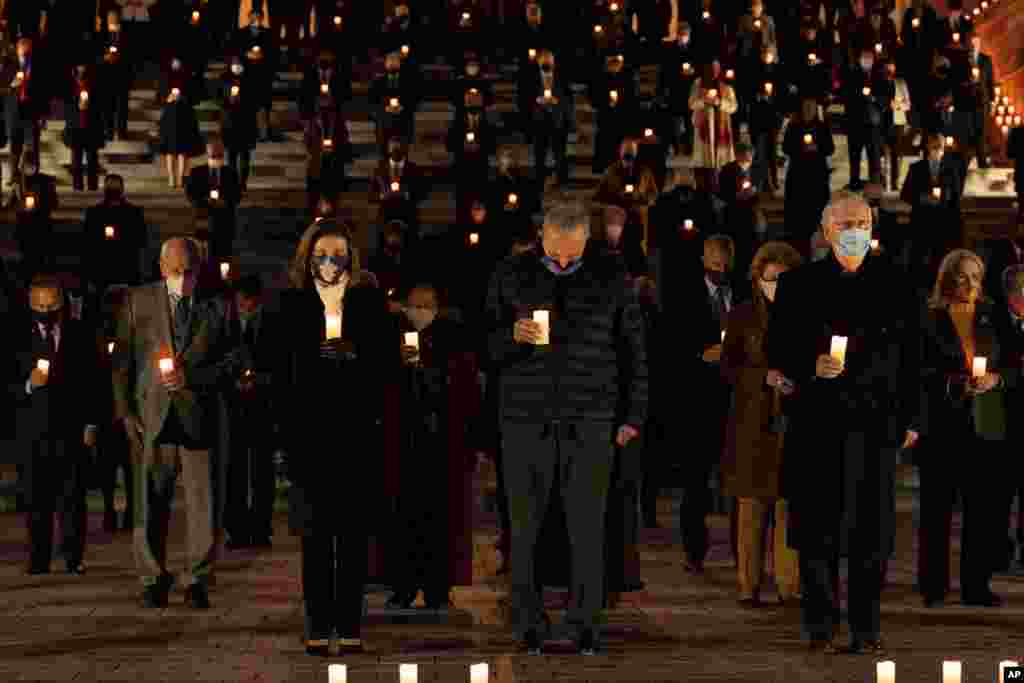 Members of the U.S. House and Senate hold a moment of silence for 500,000 U.S. COVID-19 deaths, Feb. 23, 2021, on the east front steps of the Capitol in Washington.