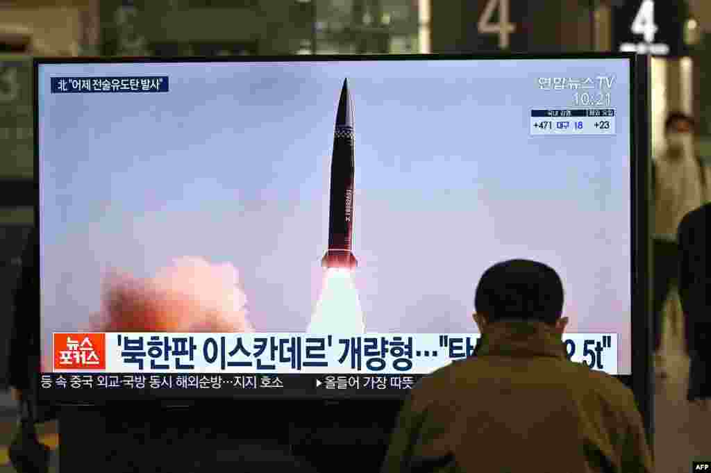 A man watches a television screen at Suseo railway station in Seoul showing news footage of North Korea&#39;s latest tactical guided projectile test.