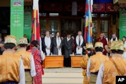 Penpa Tsering, center, president of the Central Tibetan Administration, observes a minute's silence with others as they mark the 66th anniversary of an uprising in Tibetan capital Lhasa, at the Tsuglakhang temple in Dharamshala, India, March 10, 2025.