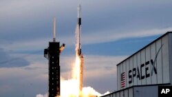 A SpaceX Falcon 9 rocket, with the Dragon capsule and a crew of four private astronauts, lifts off from pad 39A, at the Kennedy Space Center in Cape Canaveral, Florida, May 21, 2023.