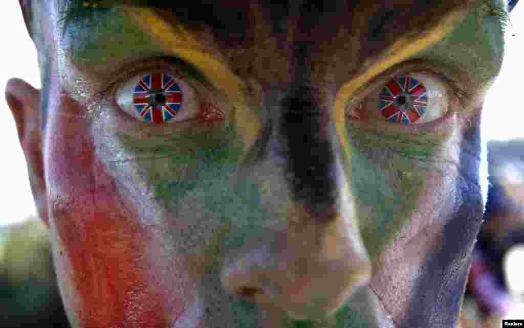 Glenn Frank from central England wears contact lenses depicting the Union flag, commonly known as the Union Jack, as he walks in the Olympic Park during the London 2012 Olympic Games August 3, 2012