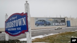 A banner depicting the Chevrolet Cruze is displayed at General Motors' Lordstown, Ohio, plant, Nov. 27, 2018. Lordstown is one of five GM plants slated for possible closure in a restructuring of the company.