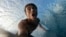 In this undated image taken from video, Tahitian-born surfer Kauli Vaast records himself surfing on the world-famous Teahupo’o wave in Tahiti. The Olympic surfing competition will be held next July at Teahupo’o as part of the 2024 Summer Games in Paris. (Kauli Vaast via AP)