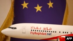 FILE -- A photograph taken on January 23, 2024 shows an aircraft model displayed at a sales office of Iraqi airline Fly Baghdad in the Iraqi capital's Jadriya district.