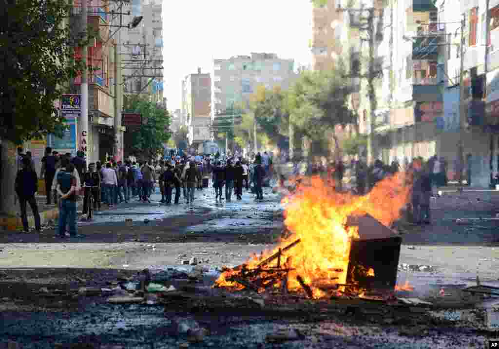 A fire blazes in the street in Diyarbakir, Turkey, Oct. 7, 2014.