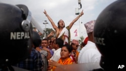 A Nepalese Hindu activist shouts slogans at a rally near the Nepalese Constituent Assembly Hall during a protest in Kathmandu, Nepal, Sept. 1, 2015.