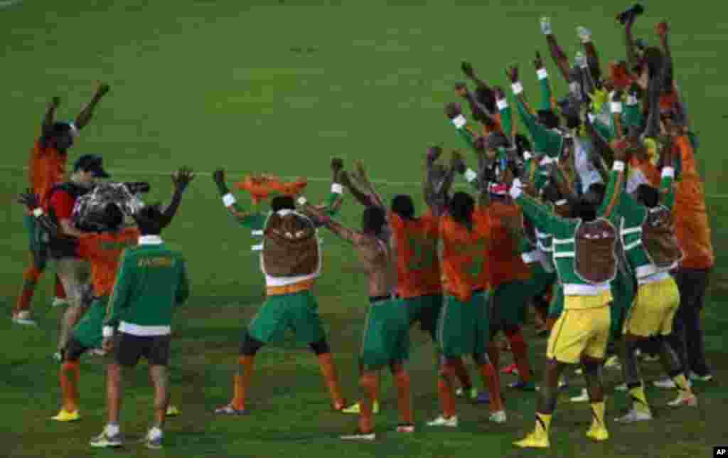 Zambia's captain Christopher Katongo (L) celebrates with his teammates after winning against Ghana during their African Nations Cup semi-final soccer match at Estadio de Bata "Bata Stadium" in Bata February 8, 2012.