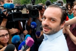 Francois Lambert (C), the nephew of Vincent Lambert, speaks to the press after the death of his uncle, at Place de la Republique in Paris, on July 11, 2019.