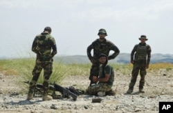 FILE - Afghanistan's National Army soldiers take positions in Khogyani district, in Nangarhar province, east of Kabul, Afghanistan.