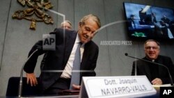 FILE - Former Pope John Paul II spokesperson Joaquin Navarro-Valls arrives at a press conference at the Vatican, April 25, 2014.