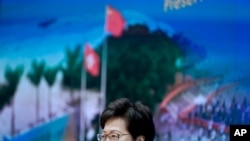 Hong Kong Chief Executive Carrie Lam speaks during a press conference in Hong Kong, April 13, 2021. Lam said Tuesday that Hong Kong's legislative elections would take place in December.