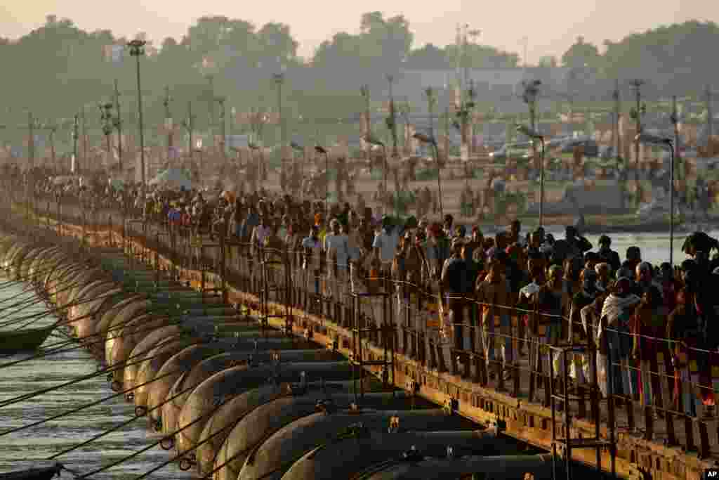 Hindu devotees arrive for a holy dip at Sangam, the confluence of the Rivers Ganges, Yamuna and mythical Saraswati in Allahabad, India.