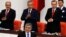 Turkey's President Abdullah Gul (C) is applauded by Prime Minister Tayyip Erdogan (R) and his ministers as he arrives to address the Turkish Parliament during a debate marking the reconvene of the parliament after a summer recess in Ankara, Oct. 1, 2013.