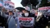 Members of main opposition Democratic Party stage a rally against South Korean President Yoon Suk Yeol in front of the National Assembly in Seoul, South Korea, Dec. 4, 2024. The signs read "Let's impeach Yoon Suk Yeol ."