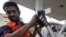 FILE - Man fills up with diesel at a fuel station in Kolkata.