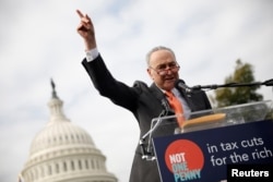 FILE - Senate Minority Leader Chuck Schumer speaks during a rally against the Republican tax bill on Capitol Hill in Washington, Nov. 15, 2017.