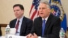 FBI Director James Comey, left, joins Timothy Roemer, a 9/11 Review Commission member and former congressman, at a news conference at FBI headquarters in Washington, March 25, 2015.