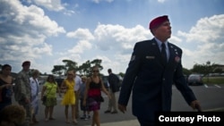 FILE - U.S. Air Force Staff Sgt. Johnnie Yellock walks with a cane to his Bronze Star Medal ceremony, at Hurlburt Field, Florida, June 26, 2012. Yellock received the Bronze Star for his deployment to Afghanistan in 2011 during which was seriously injured by an IED. (Photo by David Salanitri)