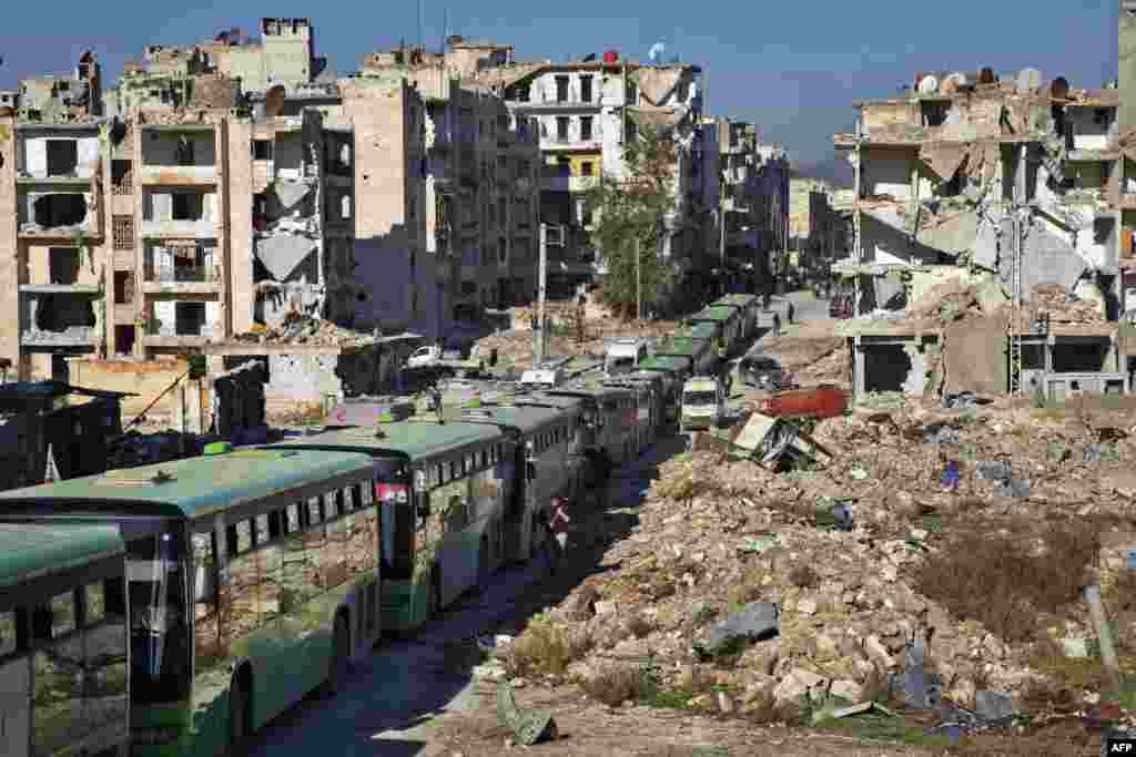 Buses are seen during an evacuation operation of rebel fighters and their families from rebel-held neighborhoods in the embattled city of Aleppo on Dec. 15, 2016.