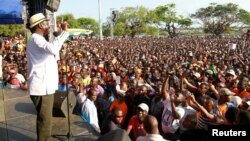 Kenyan opposition leader Raila Odinga addresses supporters during a rally in Mombasa, Kenya, Oct. 15, 2017.