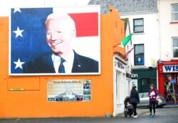 A mural of U.S. presidential candidate Joe Biden is seen on a gable wall in Ballina, west of Ireland, Nov. 4, 2020. Ballina is the ancestral home of Biden.