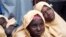 FILE - Some of the newly-released Dapchi schoolgirls are pictured in Jumbam village, Yobe State, Nigeria March 21, 2018. 
