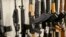 FILE - Various models of semi-automatic rifles are displayed at a store in Pennsylvania, March 1, 2018.