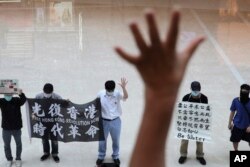 ہانگ کانگ میں جمعے کے ایک مظاہرے میں ان پانچ نکات کو یاد دلایا جا رہا ہے جس کا چین نے برطانیہ سے ہانگ کانگ کی واپسی پر وعدہ کیا تھا۔