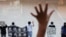 Protesters gesture with five fingers, signifying 'Five demands - not one less' in a shopping mall during a protest against China's national security legislation for the city, in Hong Kong, May 29, 2020.