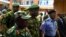 FILE: Nigerian mlitary officials are consulting with Sri Lanka on tactics that country used to overcome terrorists. Here, Nigerian Gen. Kenneth Minimah and guards leave a meeting in Abuja on May 15, 2014.